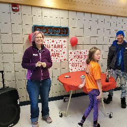 Parent helpers marking shirts at the fun run